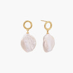 18K gold vermeil twisted circle studs with organic white baroque pearl drops on cream background