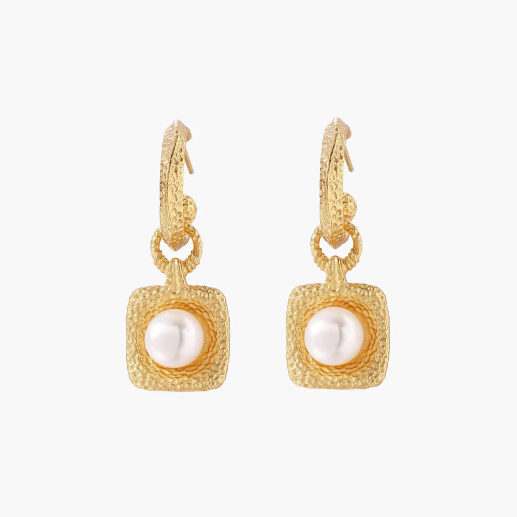 Pair of gold vermeil hoop earrings with textured square frames holding freshwater pearls on cream background