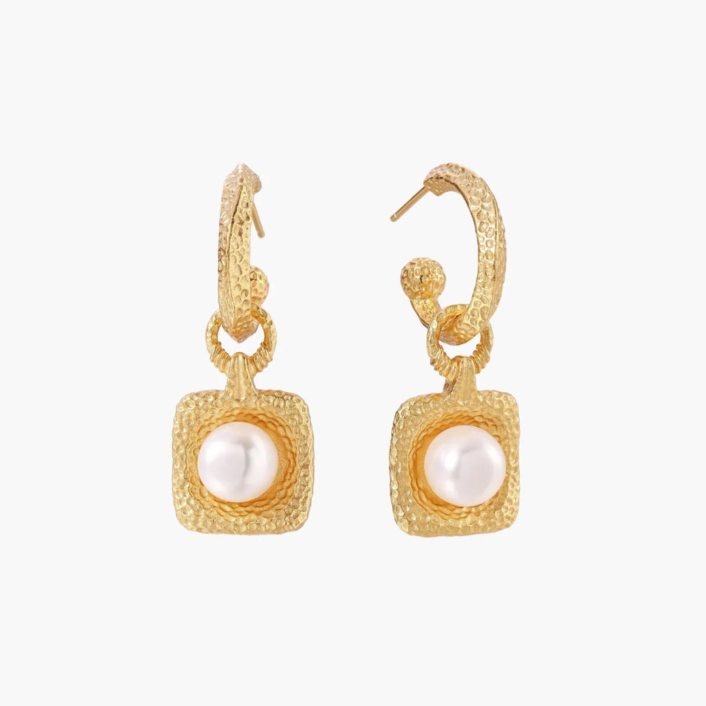 Pair of gold vermeil hoop earrings with textured square frames holding freshwater pearls on cream background