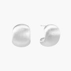 Brushed sterling silver cushion-shaped stud earrings with matte finish on white background