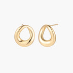 Pair of polished 18K gold-plated stainless steel teardrop earrings with hollow centers on cream background