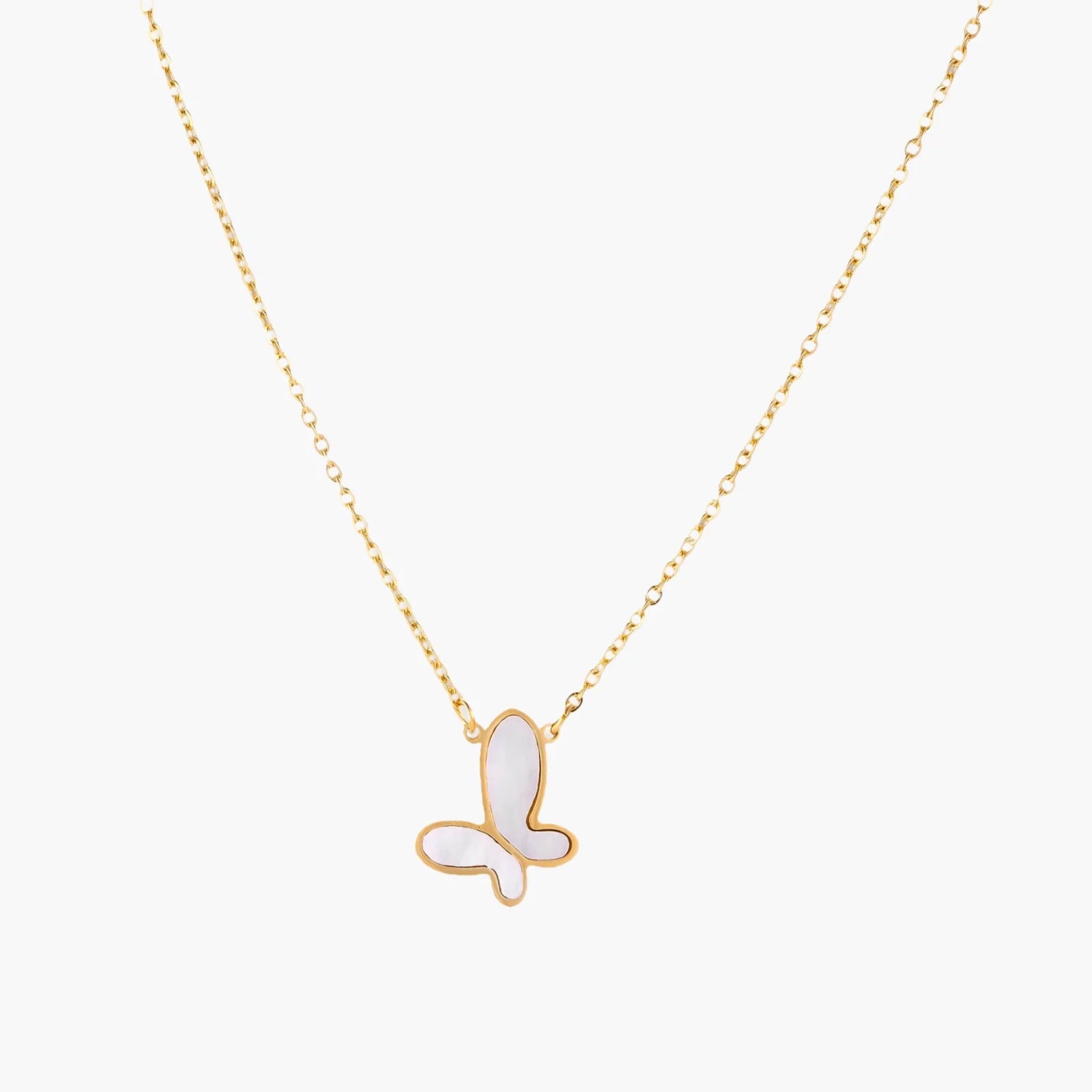 Gold-plated butterfly pendant with iridescent mother of pearl inlay on delicate chain against cream background.
