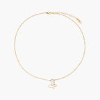 Gold-plated butterfly pendant with iridescent mother of pearl inlay on delicate chain against cream background.