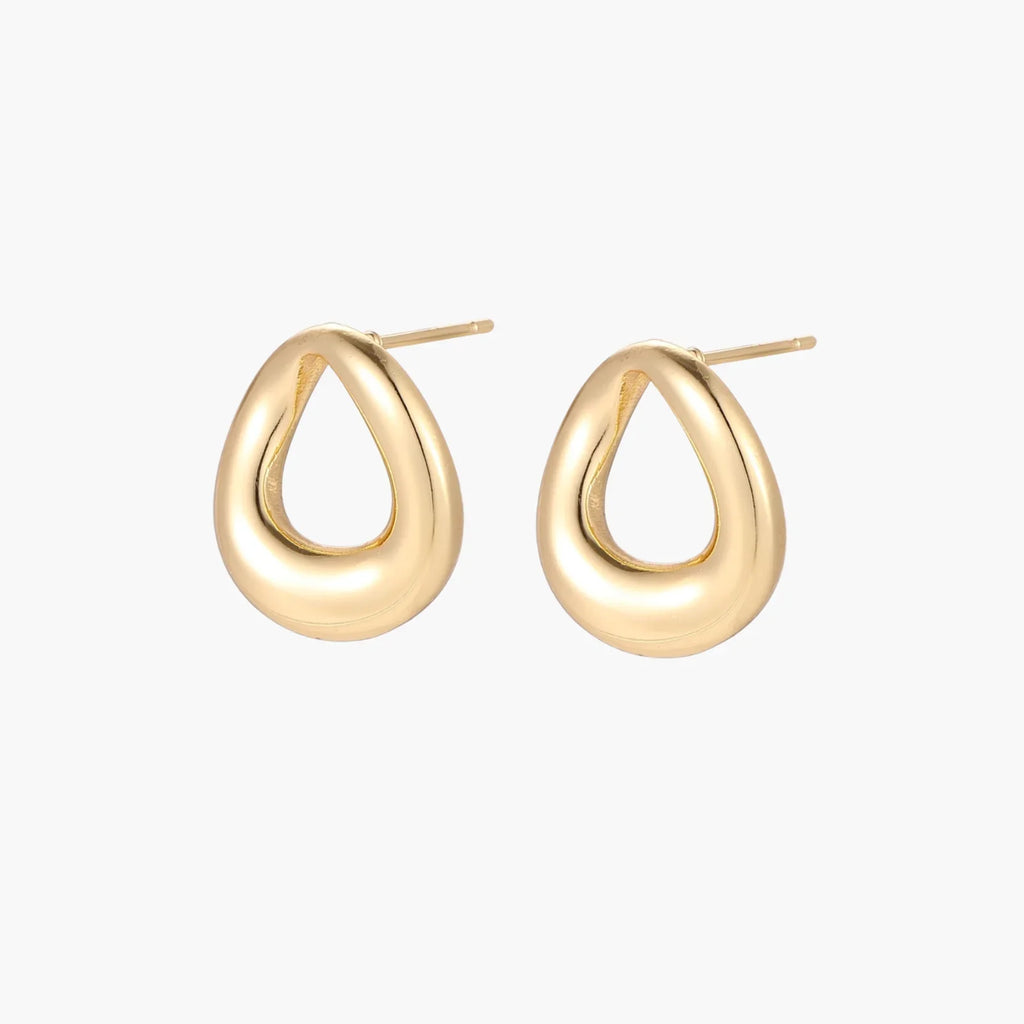 Pair of polished 18K gold-plated stainless steel teardrop earrings with hollow centers on cream background