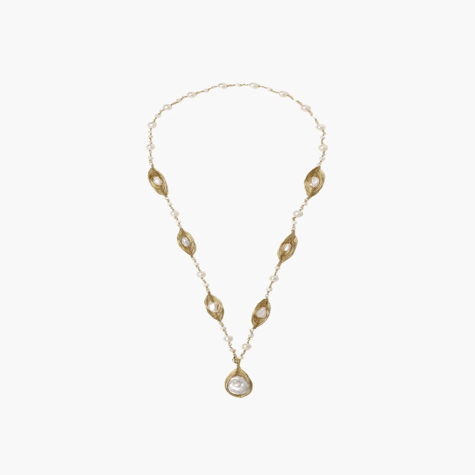 14K gold-plated necklace with eye-shaped stations and baroque pearl pendant on cream background