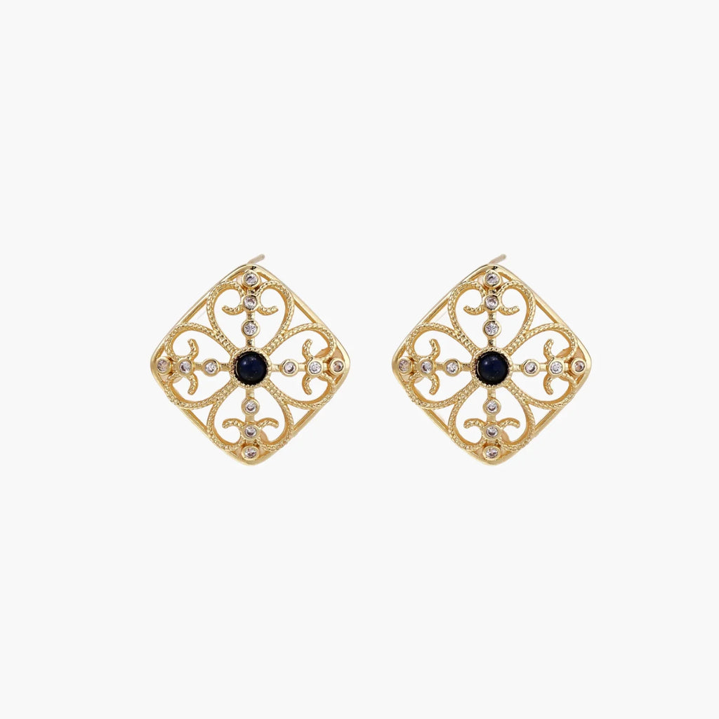 Gold filigree stud earrings with navy lapis lazuli center stone and mother-of-pearl accents in ornate quatrefoil design