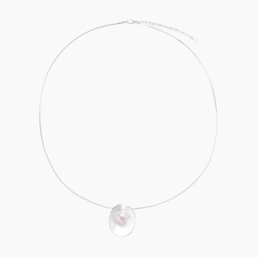 Sterling silver disc necklace with textured finish and centered freshwater pearl on delicate chain