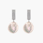 Rhodium-plated silver curved stud with pave stones and baroque pearl drop on white background