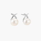 Rhodium-plated silver stud earrings with sparkling X design above lustrous round freshwater pearls on white background.