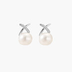 Rhodium-plated silver stud earrings with sparkling X design above lustrous round freshwater pearls on white background.