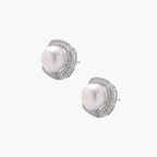 Cushion-shaped sterling silver stud earrings with freshwater pearls surrounded by geometric diamond halos