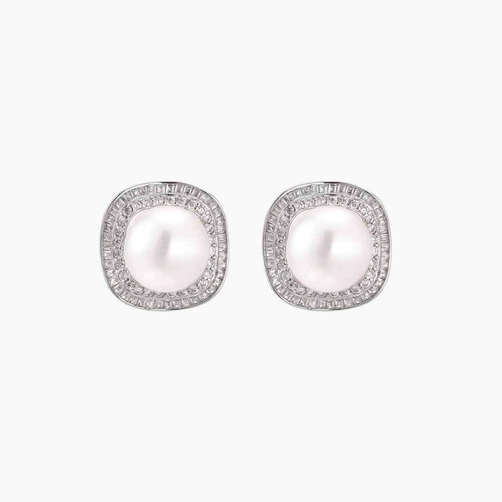 Cushion-shaped sterling silver stud earrings with freshwater pearls surrounded by geometric diamond halos