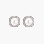 Cushion-shaped sterling silver stud earrings with freshwater pearls surrounded by geometric diamond halos