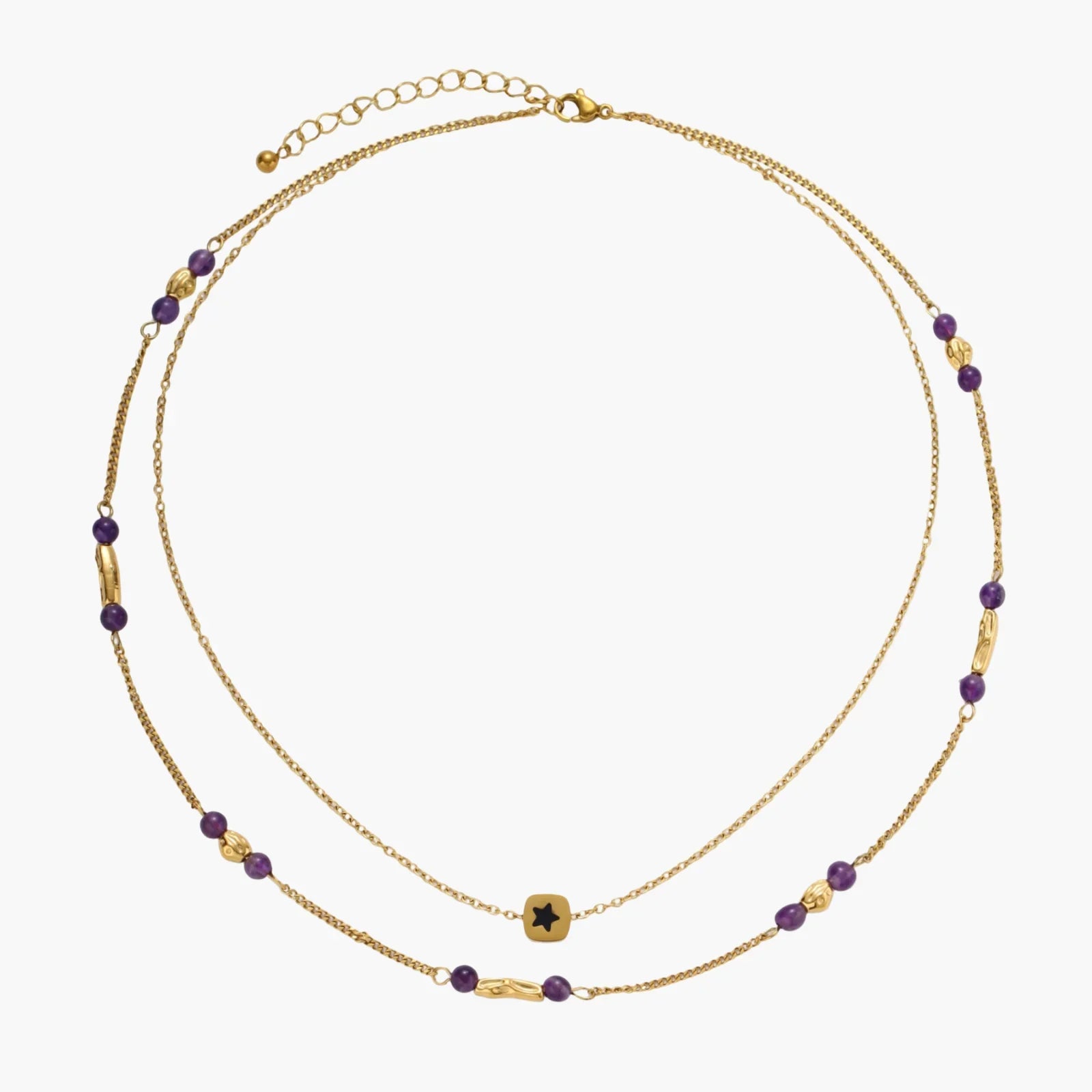 Two layered gold-tone necklaces with purple stone beads and star pendant against cream background.