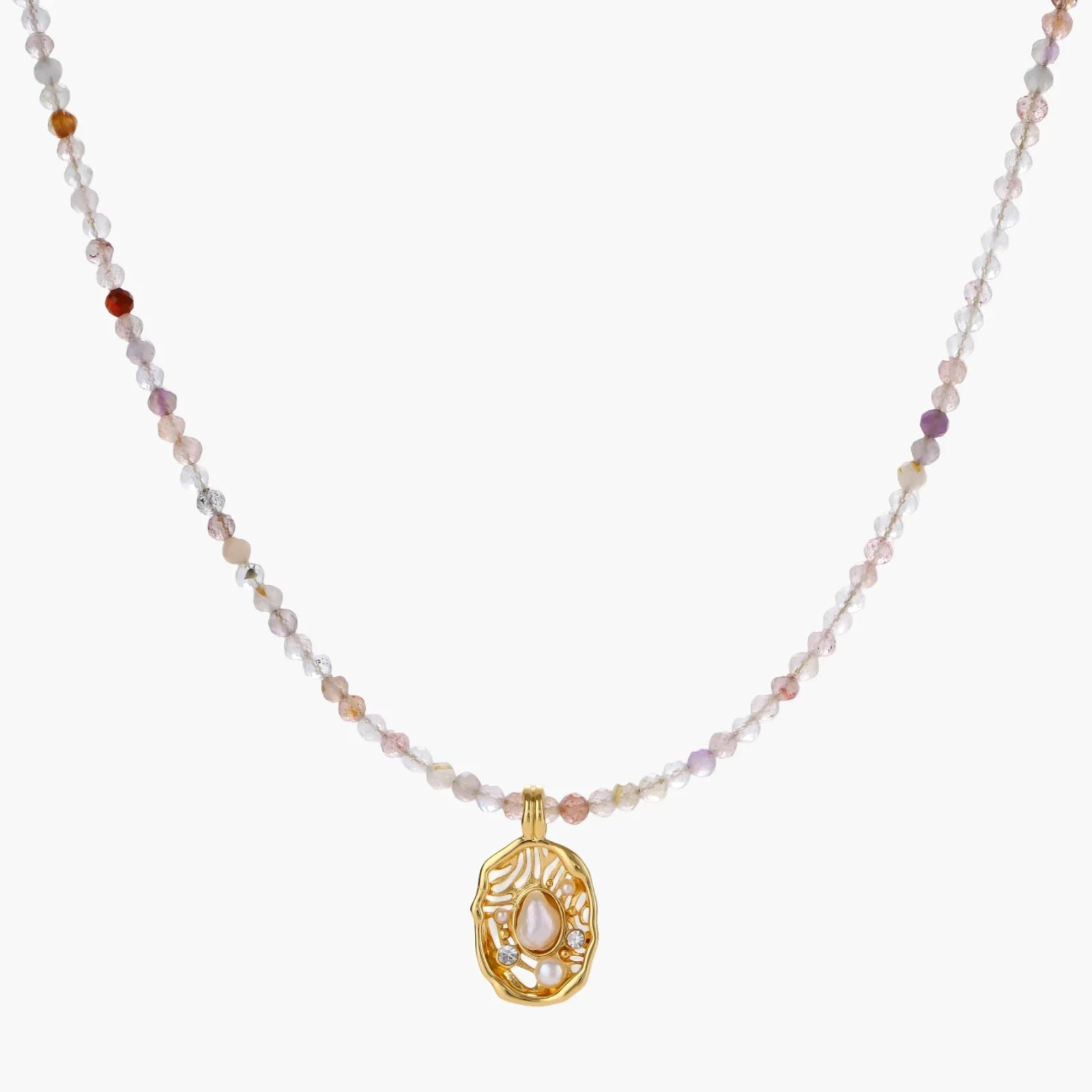 Delicate gold-plated necklace with mixed gemstone beads and ornate oval pendant on white background