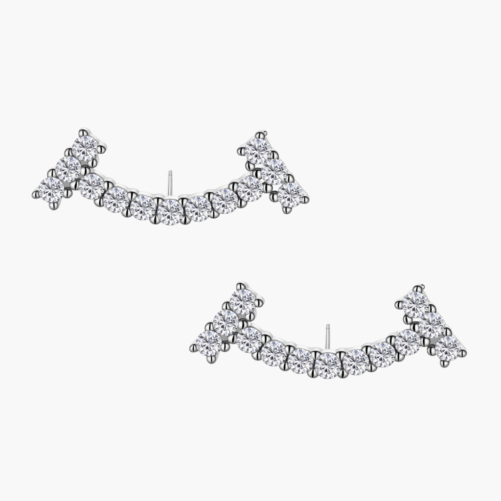 Curved sterling silver ear climbers with moissanite stones arranged in elegant arc shape on white background