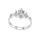 Diamond ring with a central stone and smaller stones on a light gray background